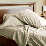 2 cozy pillows on a bed beige sand melange bamboo pillowcases and sheet set