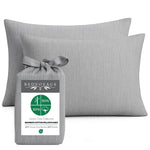 Gray bamboo pillowcases with a Bedvoyage packaging label on a white background