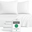 White bamboo bedding set with pillows and a package labeled 'BedVoyage' on a white background
