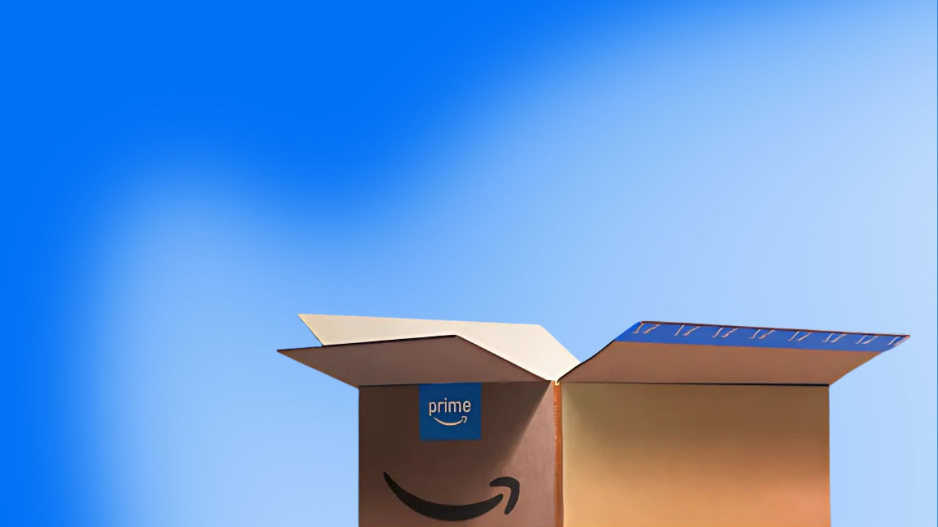 Open cardboard box with Amazon logo and 'Prime' label against a blue sky
