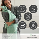 Woman holding a green towel with product features listed on a white tiled wall background