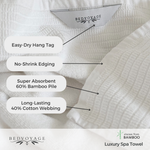 White spa towel with features labeled and Bedvoyage branding.