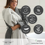 Woman wrapped in a gray spa towel with product features highlighted