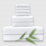 8 piece white bamboo towel stack showing basket weave edge and a bamboo plant
