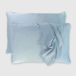 light blue sky pillowcases on floating pillows with pillowcase draped over pillow