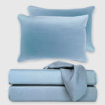 light blue sky bamboo sheet set stack with floating pillow above it