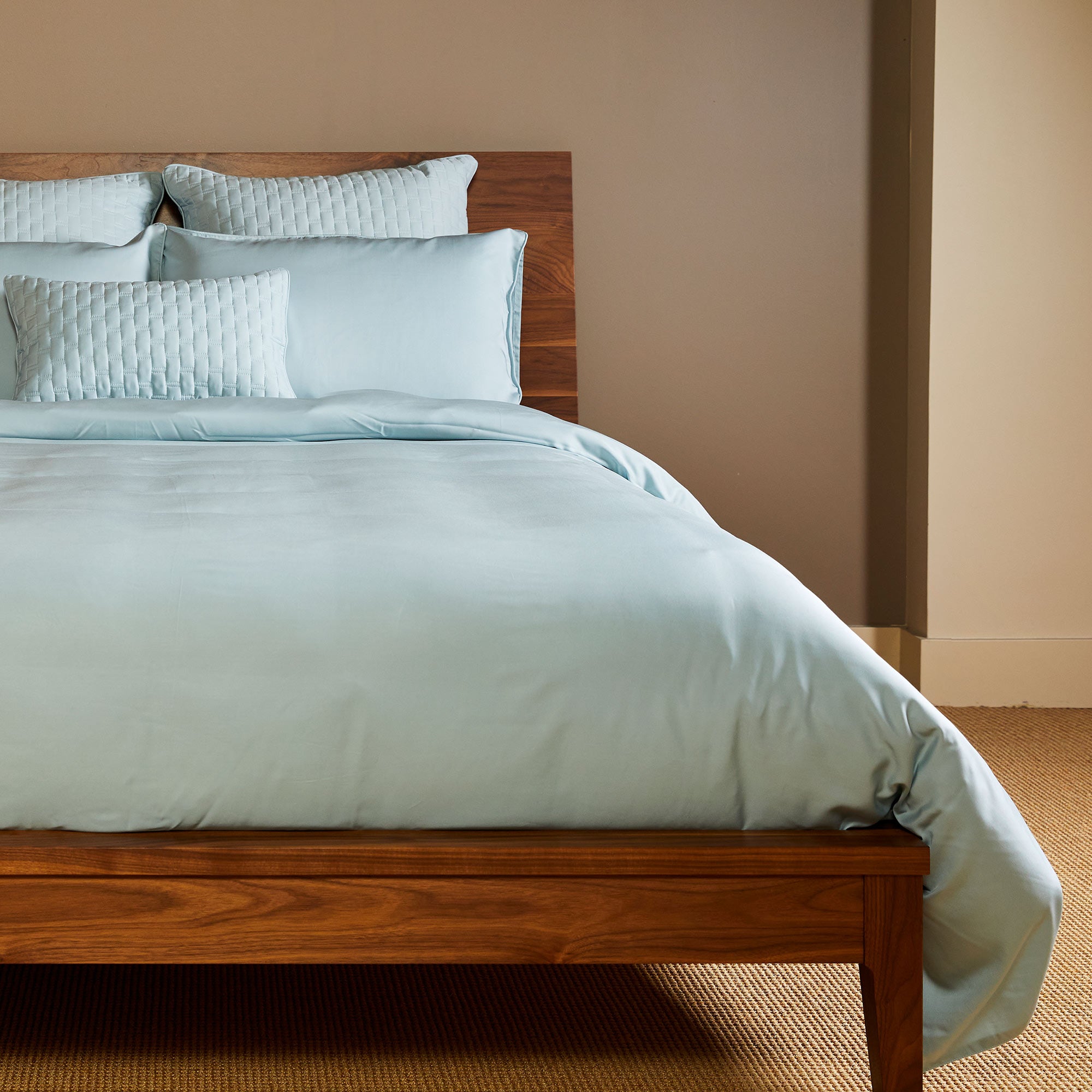 sky blue bamboo duvet cover on a pretty bamboo wood bed with pillows